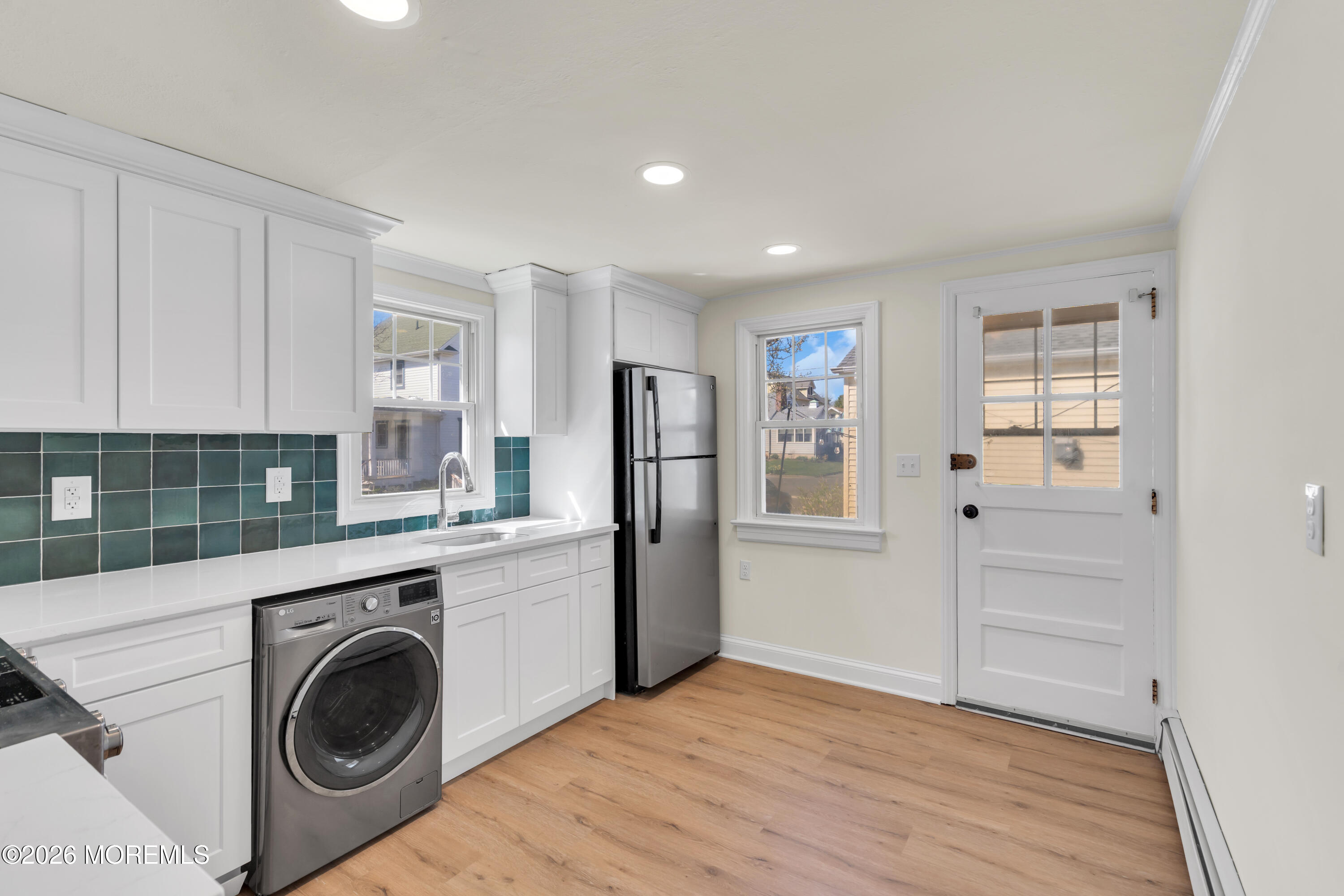 137 Inskip Avenue Ocean Grove, NJ 07756 - Photo 26 of 36 a view of a kitchen with refrigerator and wooden floor
