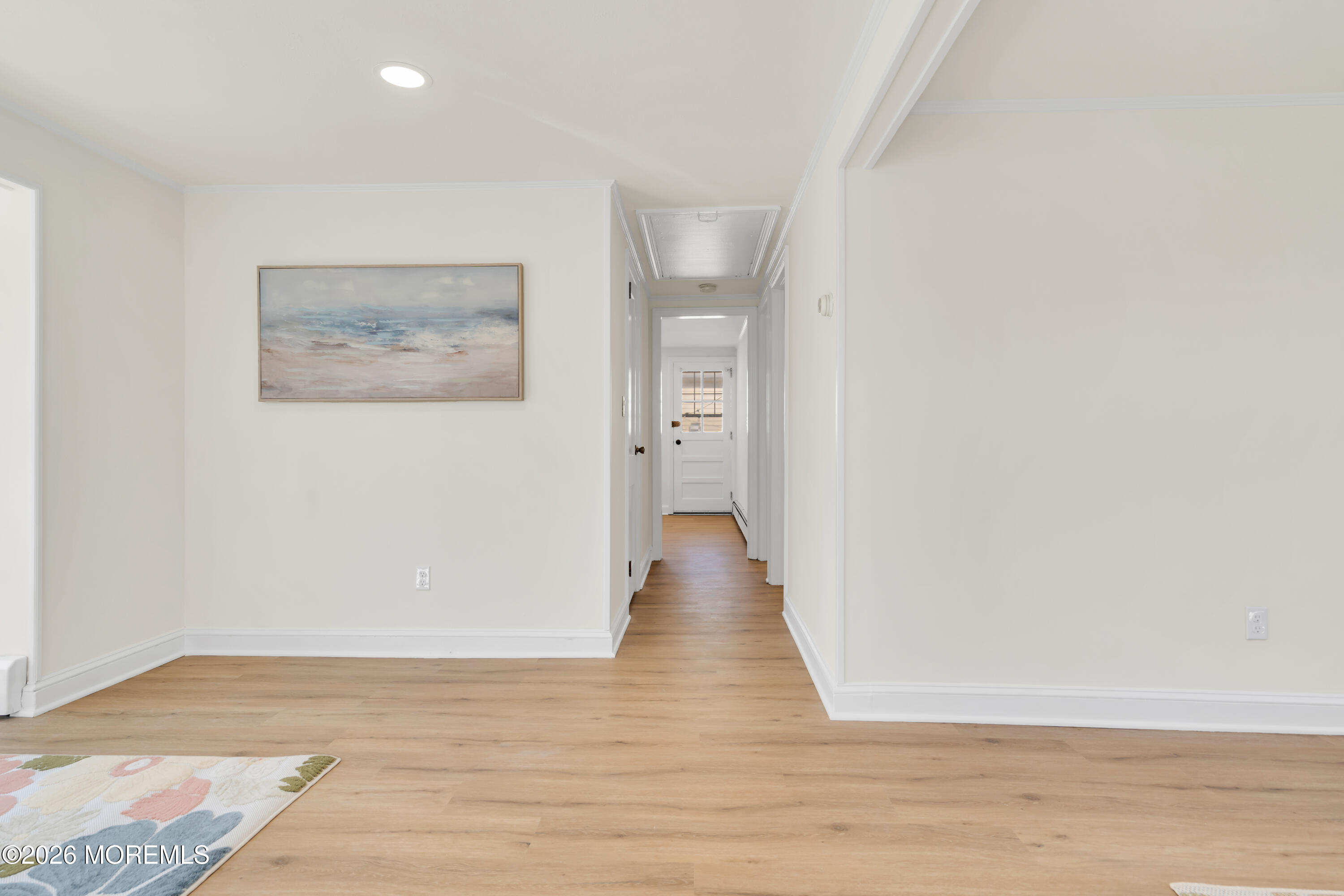 137 Inskip Avenue Ocean Grove, NJ 07756 - Photo 30 of 36 a view of an empty room with wooden floor