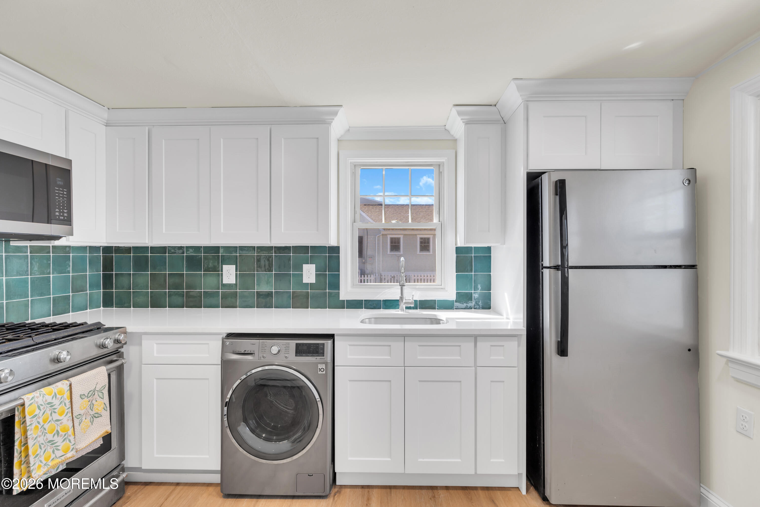 137 Inskip Avenue Ocean Grove, NJ 07756 - Photo 31 of 36 a kitchen with stainless steel appliances granite countertop a refrigerator and a stove top oven