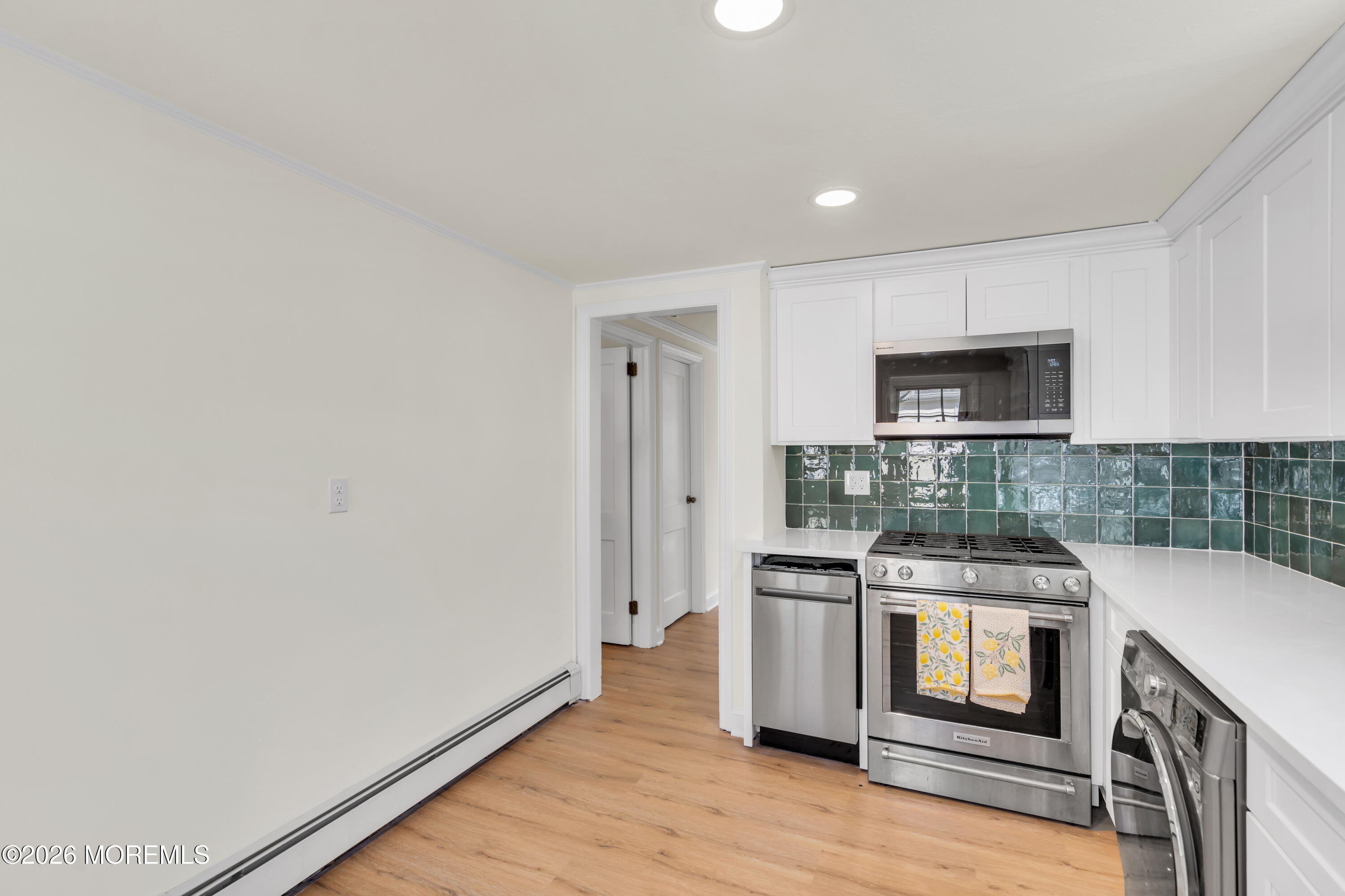 137 Inskip Avenue Ocean Grove, NJ 07756 - Photo 33 of 36 a kitchen with stainless steel appliances granite countertop a stove and a microwave