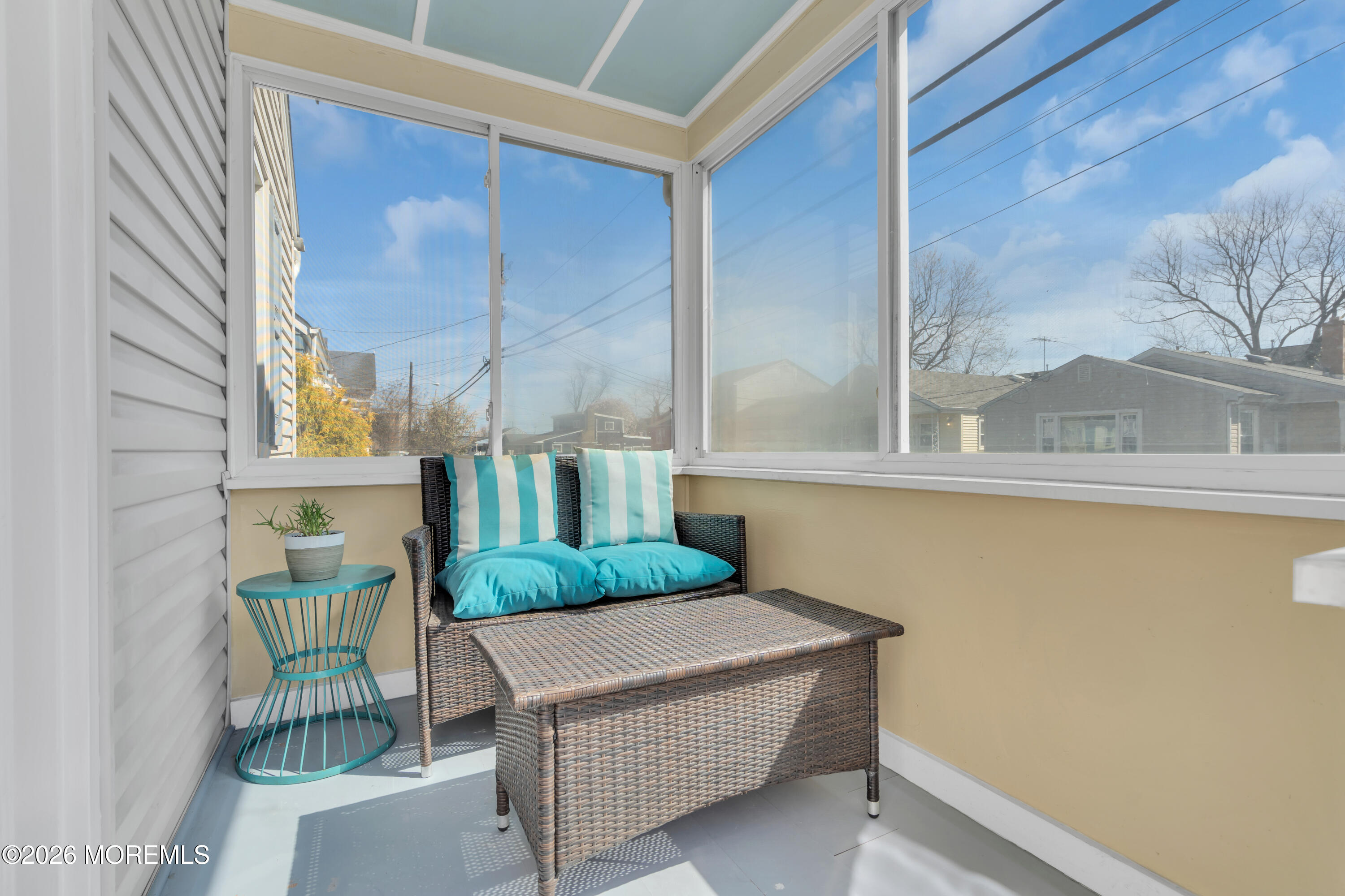 137 Inskip Avenue Ocean Grove, NJ 07756 - Photo 35 of 36 a living room with a couch and a table
