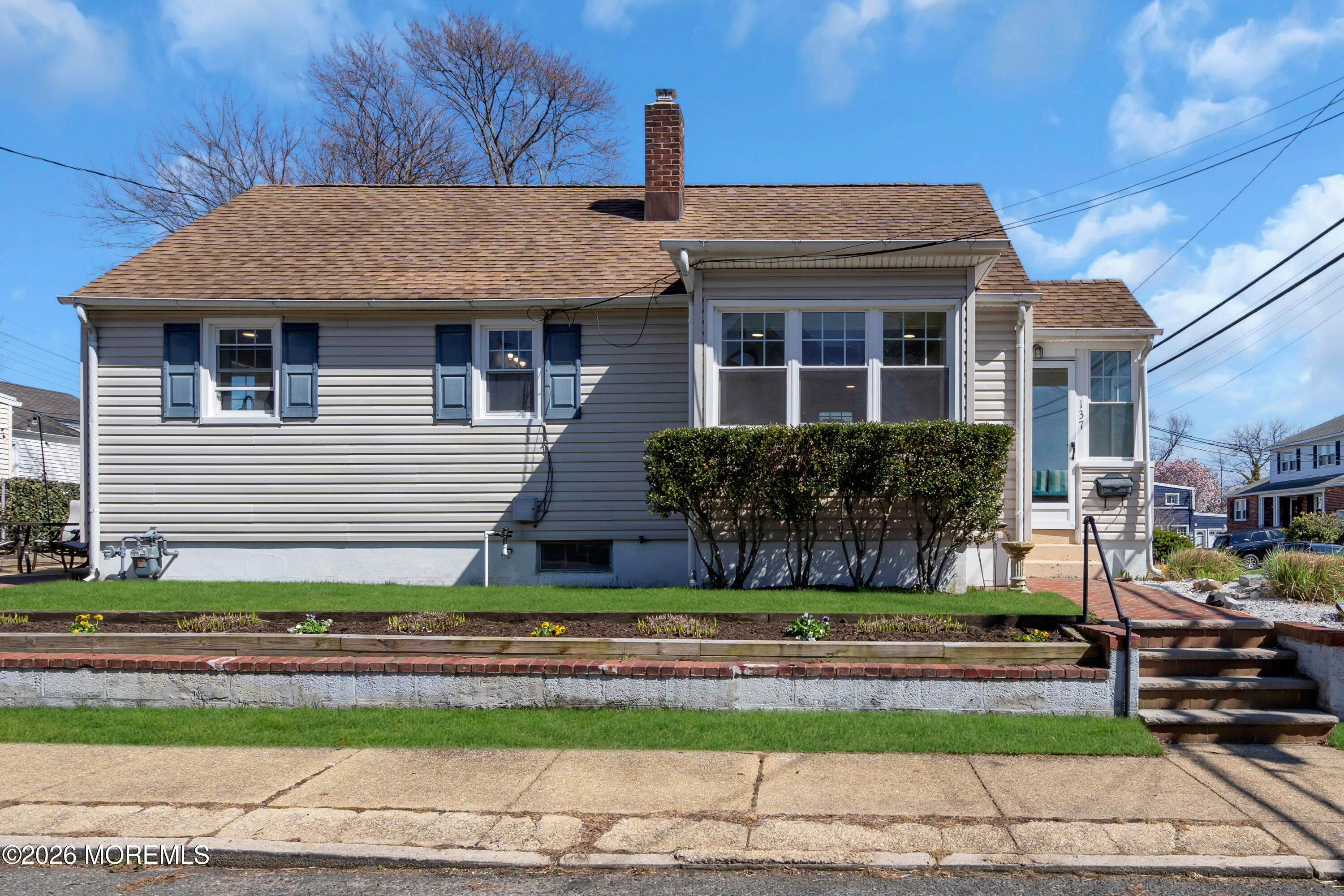 137 Inskip Avenue Ocean Grove, NJ 07756 - Photo 4 of 36 a front view of a house with a yard