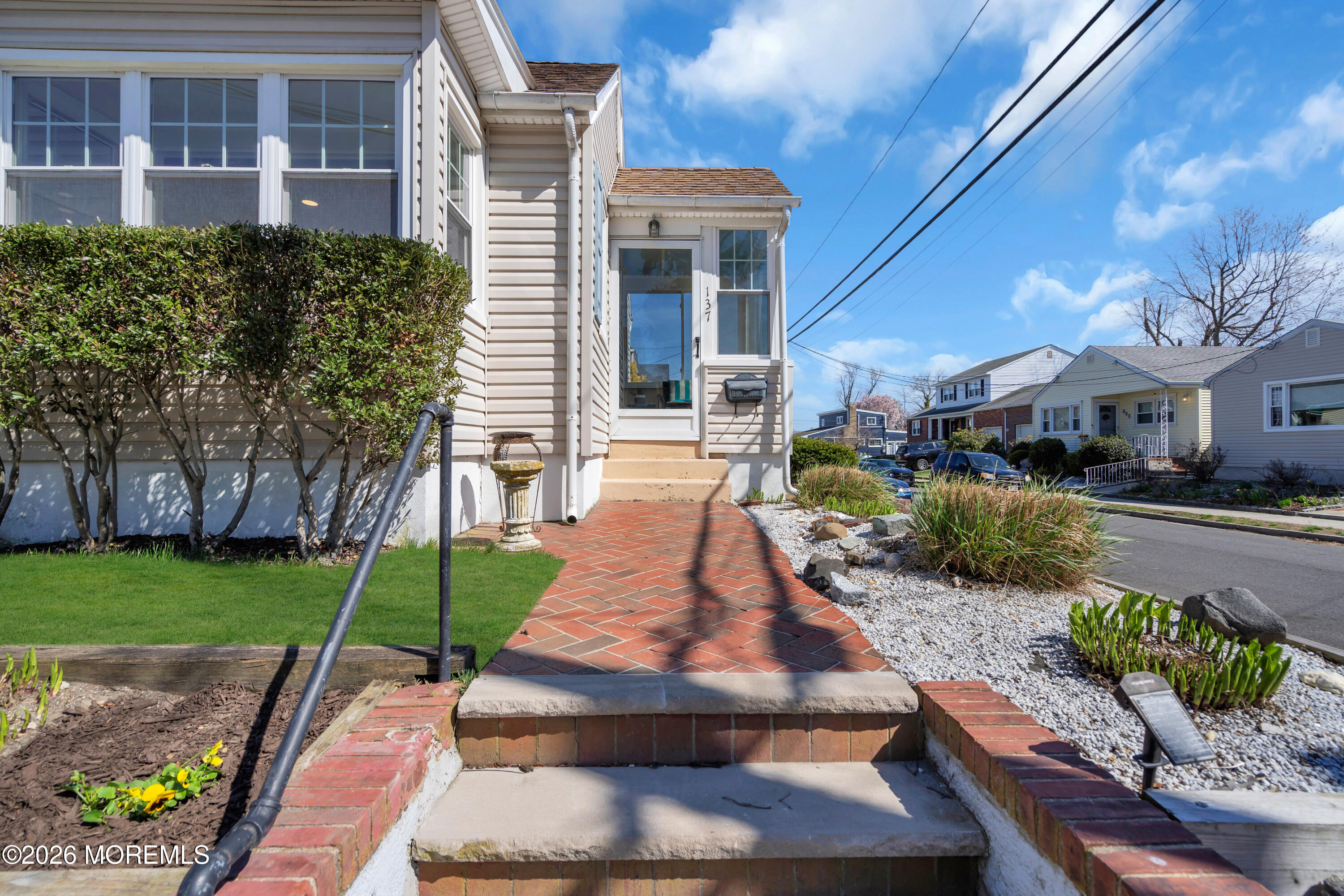 137 Inskip Avenue Ocean Grove, NJ 07756 - Photo 8 of 36 a front view of a house with garden