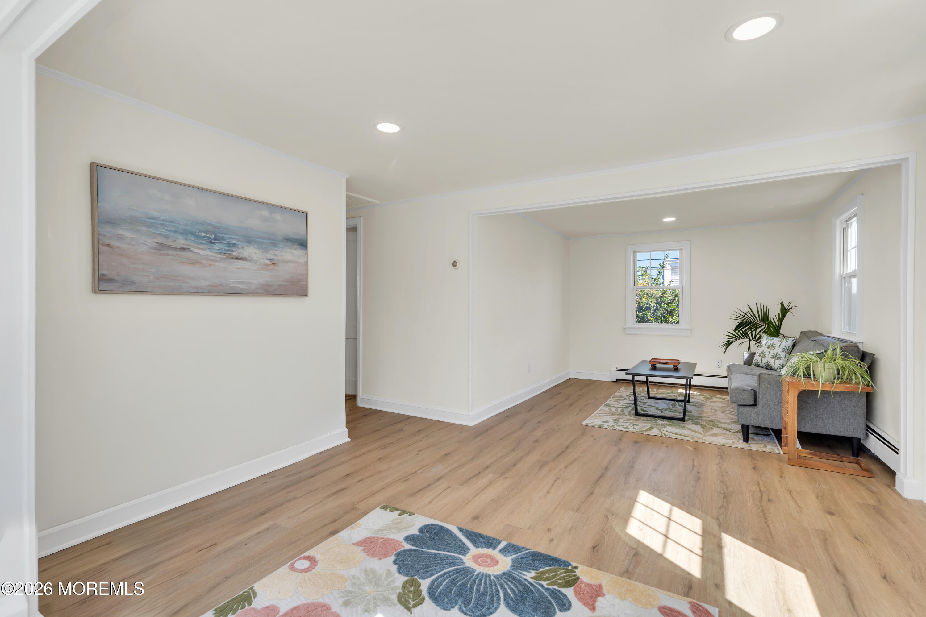 137 Inskip Avenue Ocean Grove, NJ 07756 - Photo 10 of 36 a living room with furniture and a wooden floor