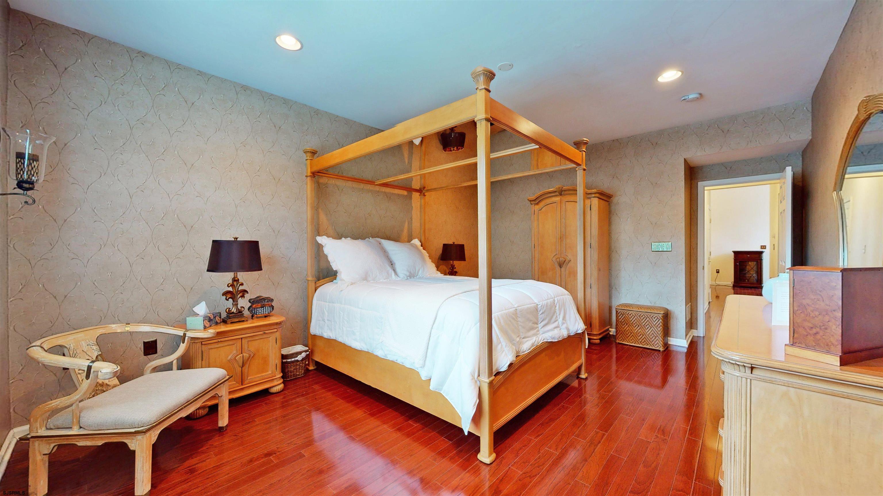 62 Ables Run Drive Absecon, NJ 08201 - Photo 16 of 38 a bedroom with a bed and wooden floor