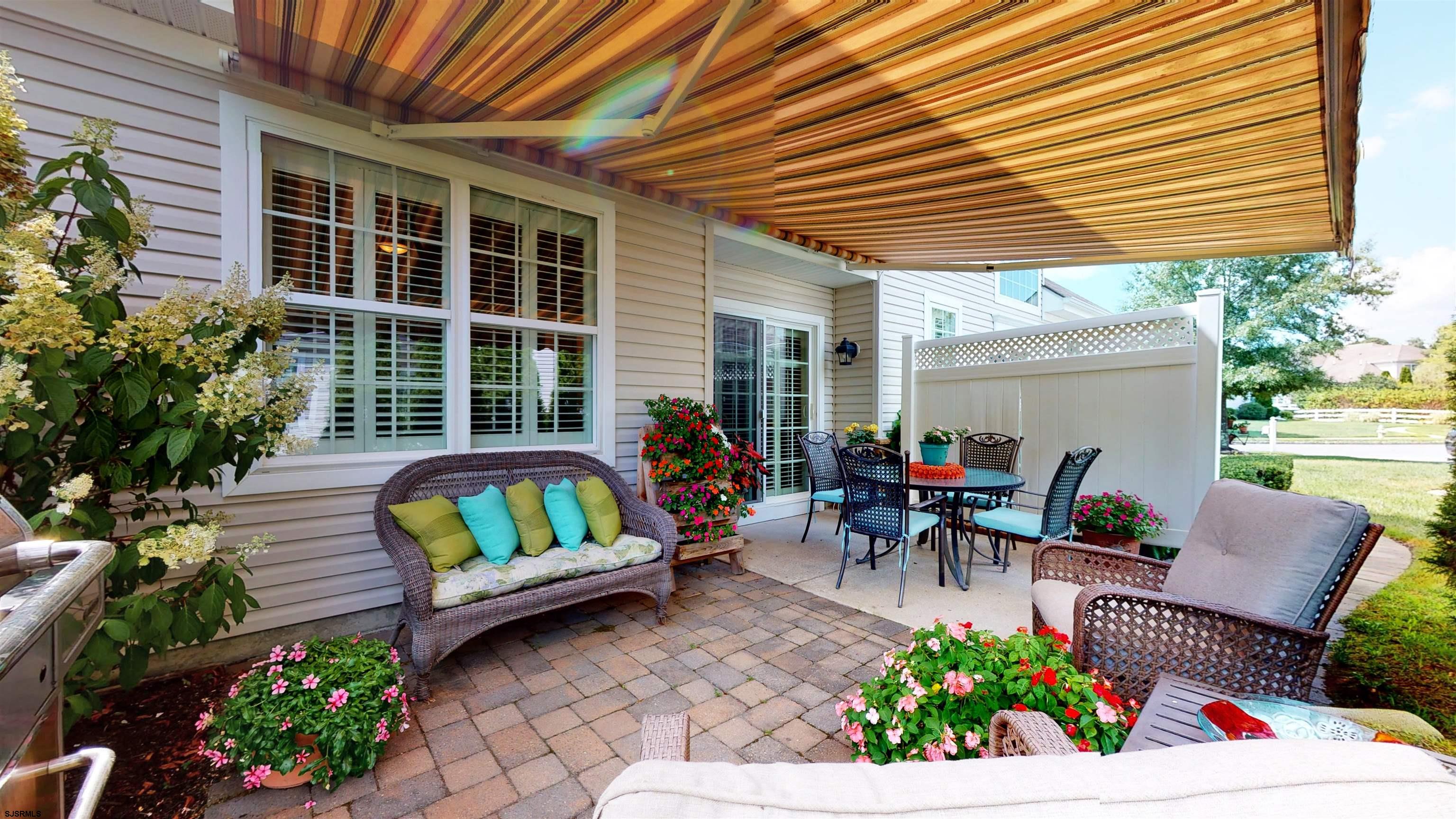 62 Ables Run Drive Absecon, NJ 08201 - Photo 30 of 38 a view of a patio with couches chairs and potted plants