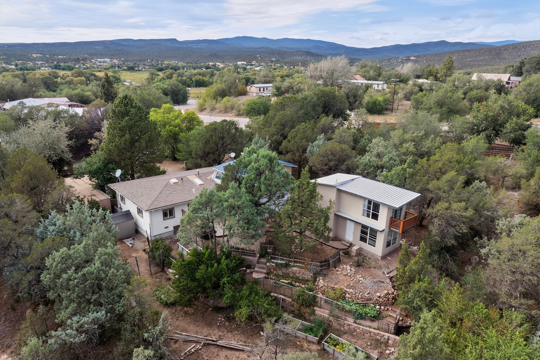 5 County Rd B51A Pecos, NM 87552 - Photo 1 of 64 Overhead view to the west showing house, studio and gardens