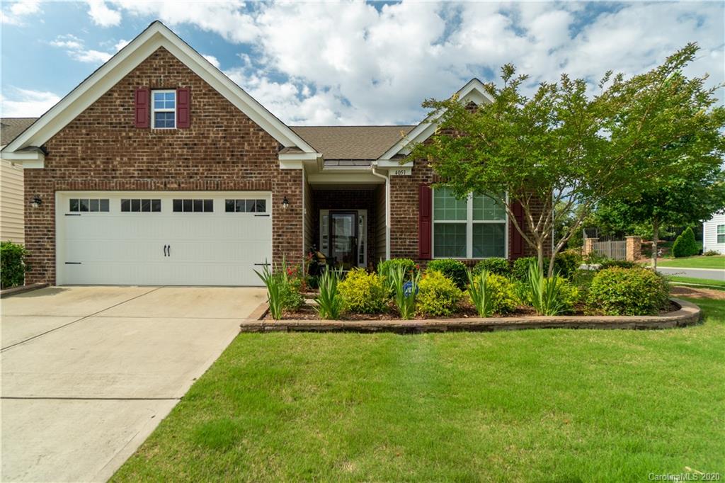 4051 Perth Road Indian Land, SC 29707 - Photo 1 of 31 a front view of a house with a yard and potted plants