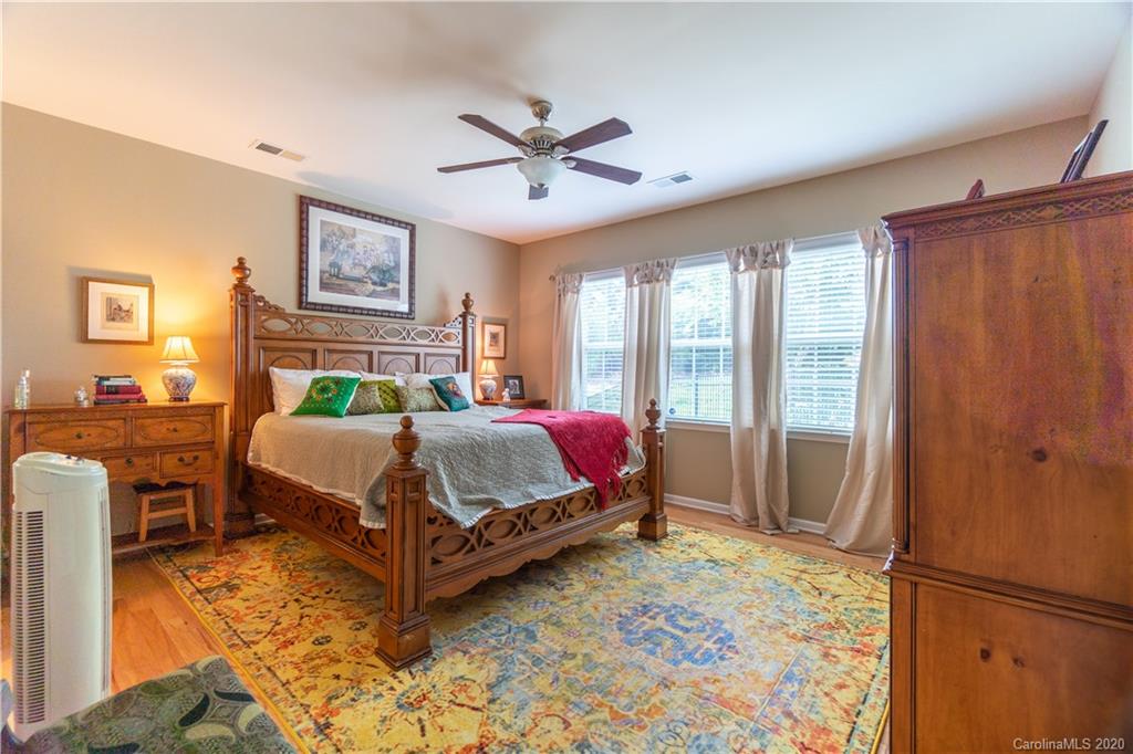4051 Perth Road Indian Land, SC 29707 - Photo 14 of 31 a bedroom with a bed lamp and a large window