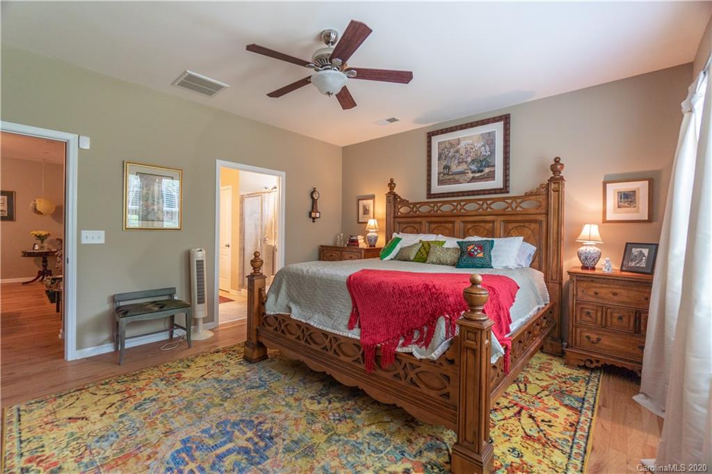 4051 Perth Road Indian Land, SC 29707 - Photo 15 of 31 a bedroom with a bed and a chandelier