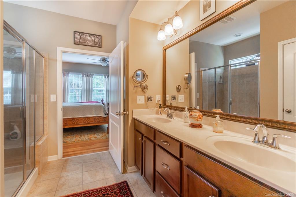 4051 Perth Road Indian Land, SC 29707 - Photo 16 of 31 a en suite bathroom with a double vanity sink and a mirror