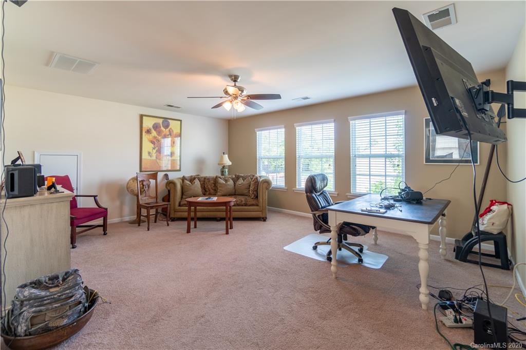 4051 Perth Road Indian Land, SC 29707 - Photo 22 of 31 a living room with furniture and a flat screen tv
