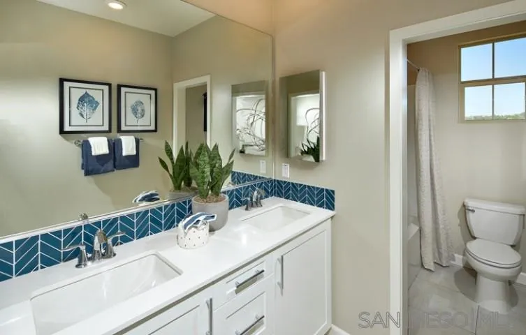 1099 Delpy View Point Vista, CA 92084 - Photo 13 of 15 a bathroom with a sink and a mirror