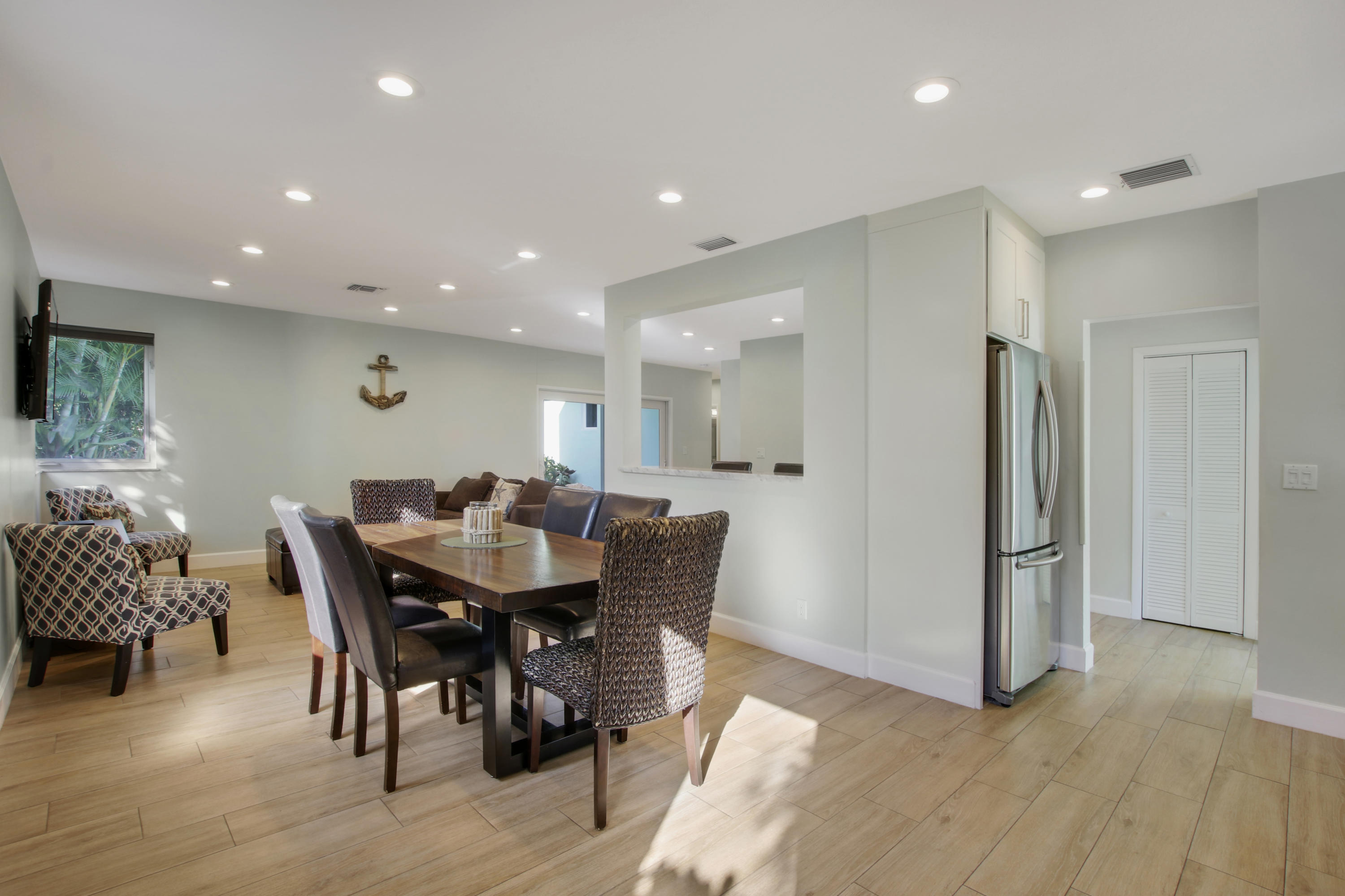 380 North Juno Lane Juno Beach, FL 33408 - Photo 11 of 22 a view of a dining room with furniture