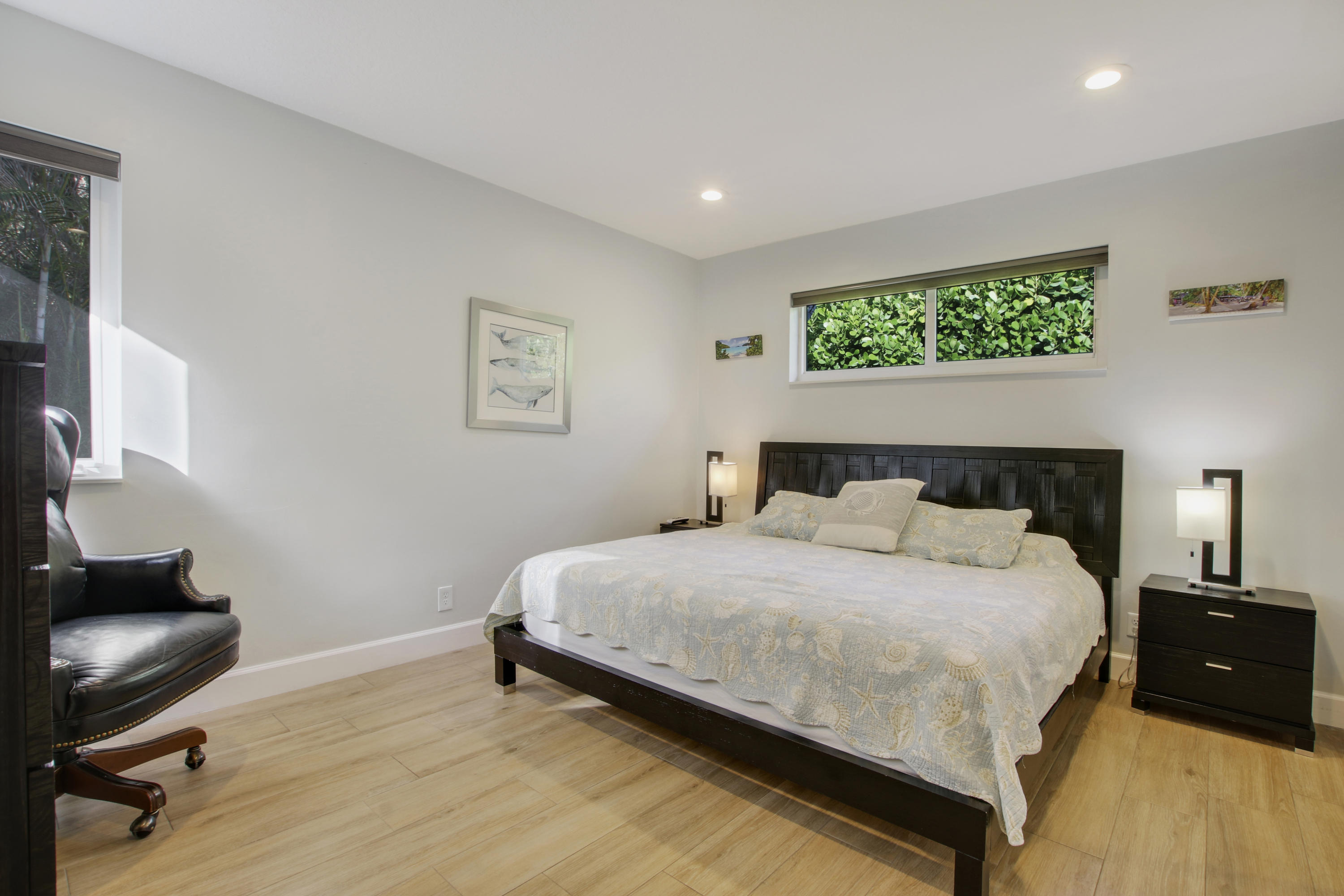 380 North Juno Lane Juno Beach, FL 33408 - Photo 14 of 22 a bedroom with a bed and a chair