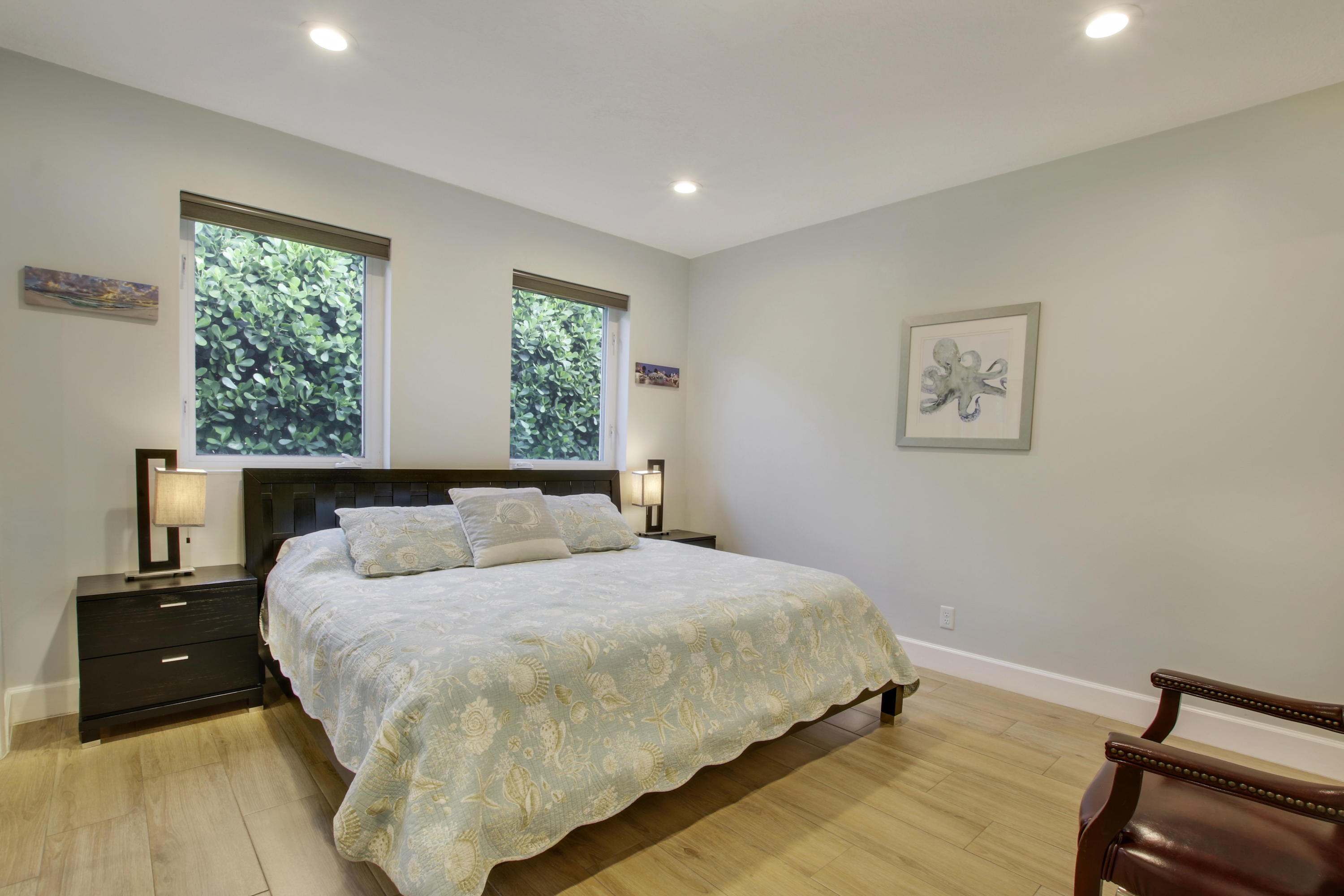 380 North Juno Lane Juno Beach, FL 33408 - Photo 16 of 22 a bedroom with a bed and a night stand