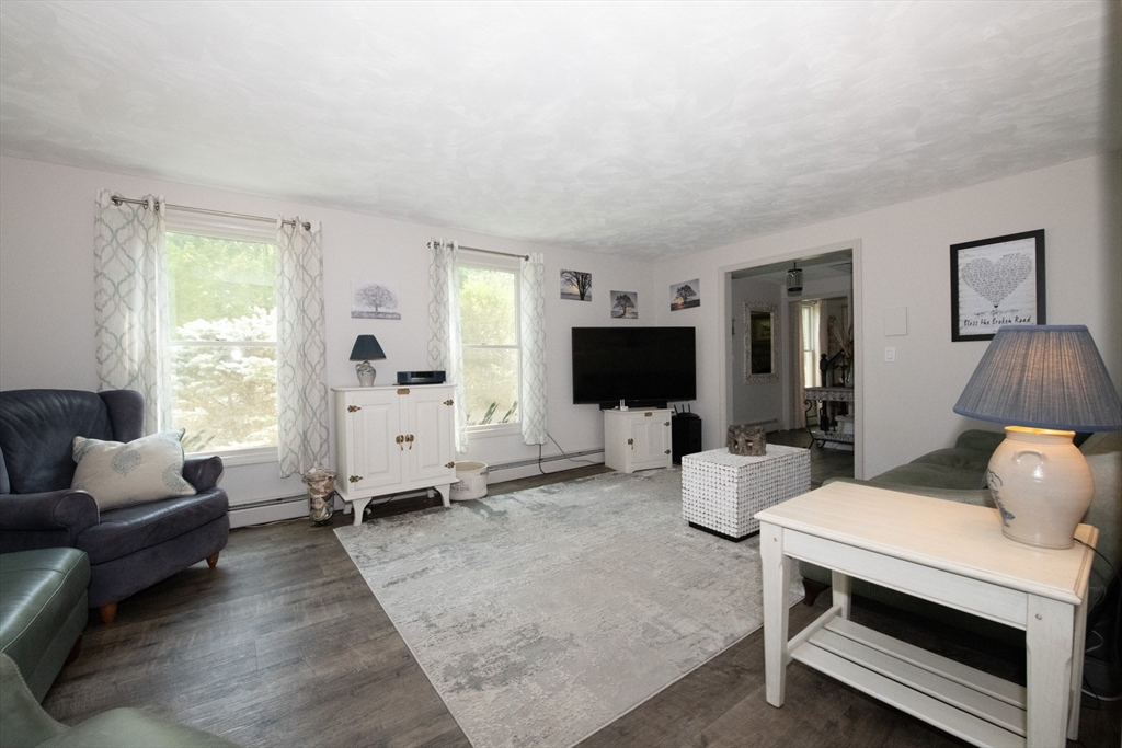 110 Mendon Road Northbridge, MA 01534 - Photo 11 of 37 a living room with furniture and a flat screen tv
