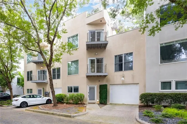 a front view of a residential houses with yard