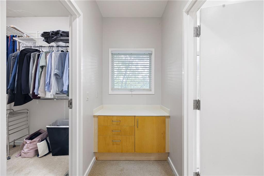 2176 Millennium Way Atlanta, GA 30319 - Photo 11 of 16 a view of walk in closet with clothes and shoes