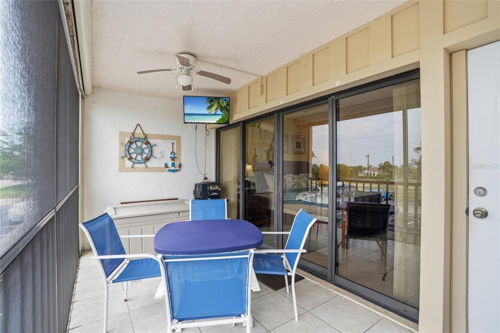 3170 Matecumbe Key Road, Unit 127 Punta Gorda, FL 33955 - Photo 17 of 22 a view of a dining room with furniture window and outside view