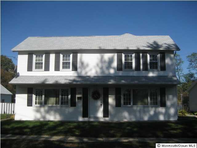 1102 Larsen Road Jackson, NJ 08527 - Photo 2 of 3 a front view of a house with swimming pool and outdoor seating