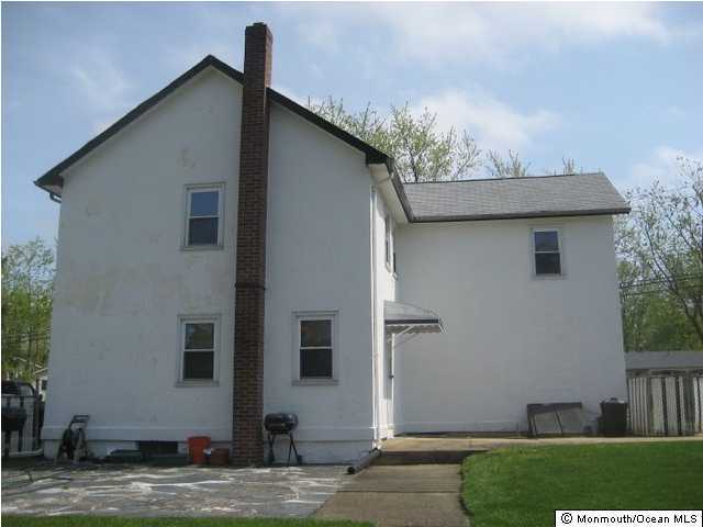 1102 Larsen Road Jackson, NJ 08527 - Photo 3 of 3 a front view of a house with garden