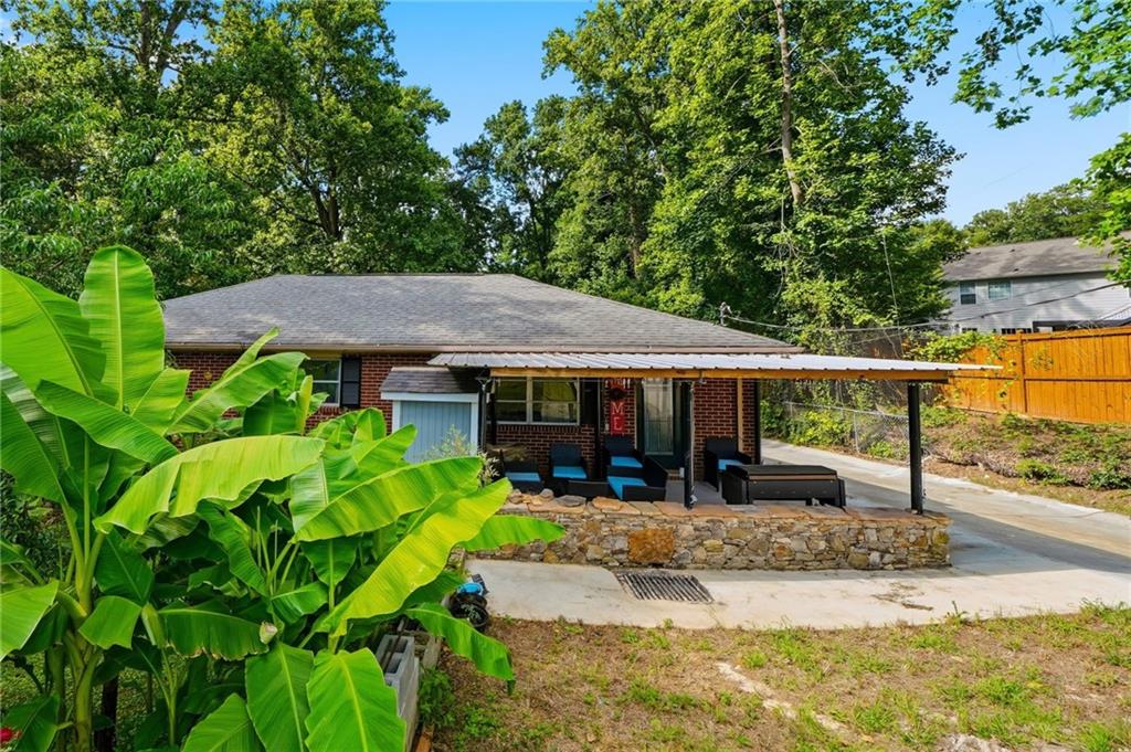 430 Church Road Southwest Marietta, GA 30060 - Photo 3 of 35 an outdoor space with seating area and trees around