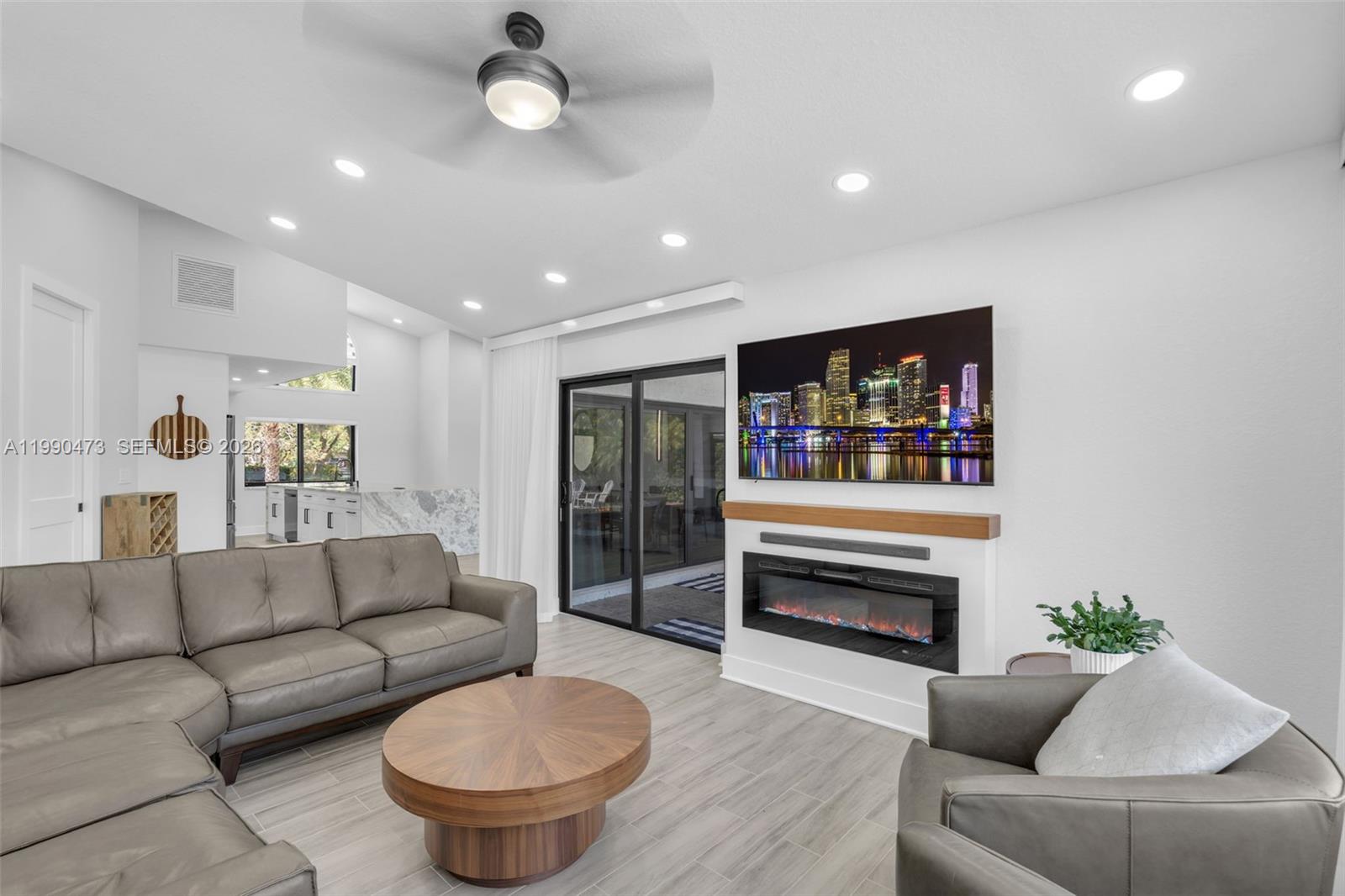 2920 Old Orchard Road Davie, FL 33328 - Photo 15 of 62 a living room with furniture and a fireplace