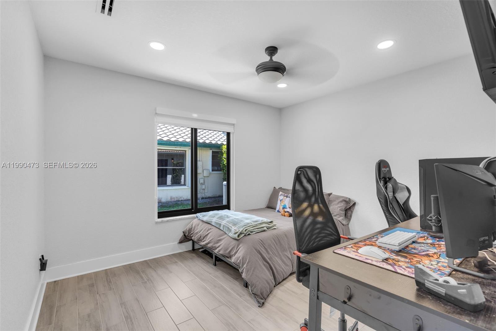 2920 Old Orchard Road Davie, FL 33328 - Photo 16 of 62 a bedroom with furniture and a window