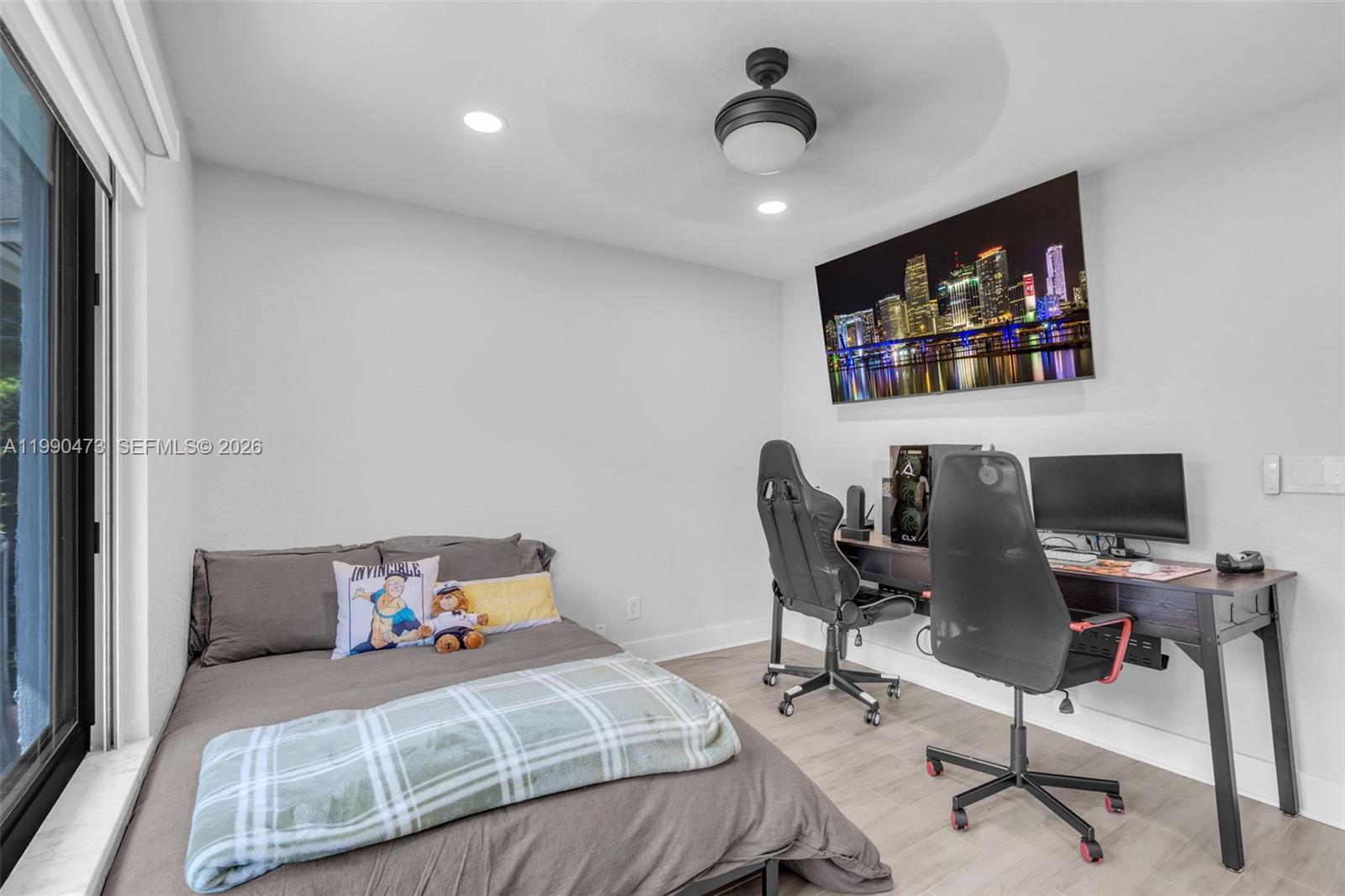 2920 Old Orchard Road Davie, FL 33328 - Photo 17 of 62 a bedroom with a bed and a desk