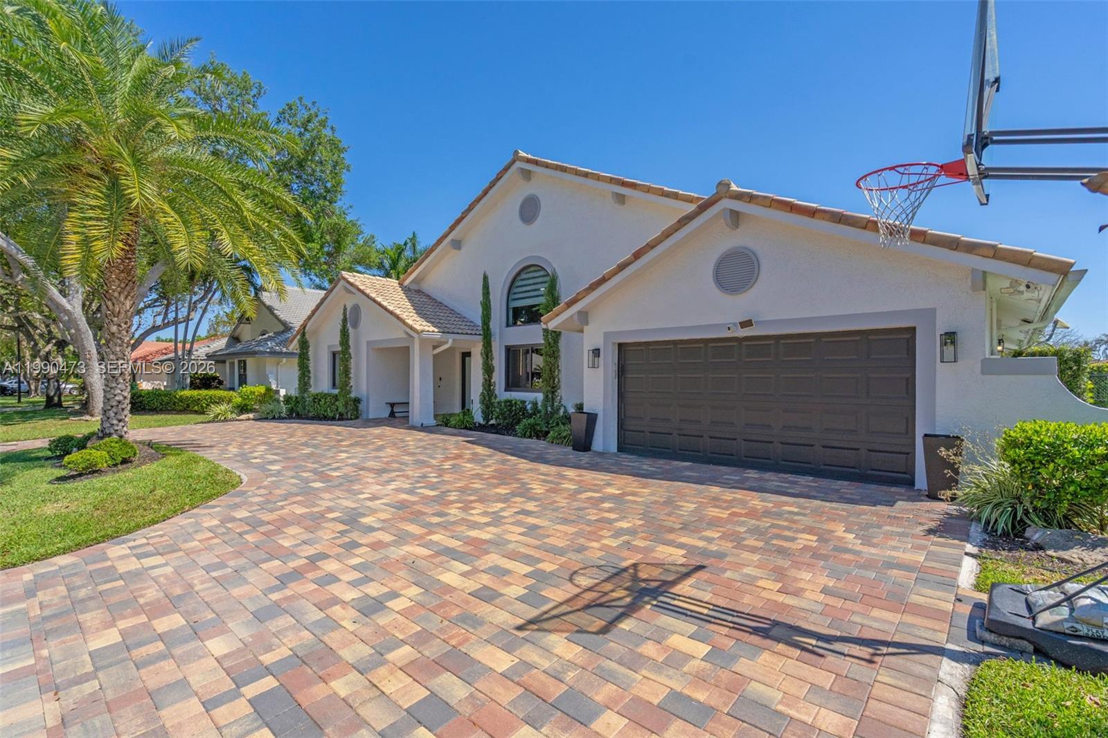 2920 Old Orchard Road Davie, FL 33328 - Photo 2 of 62 a front view of a house with a yard and garage
