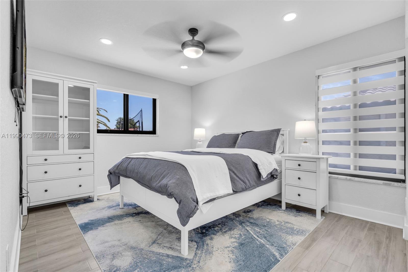 2920 Old Orchard Road Davie, FL 33328 - Photo 21 of 62 a bedroom with a large bed and a window