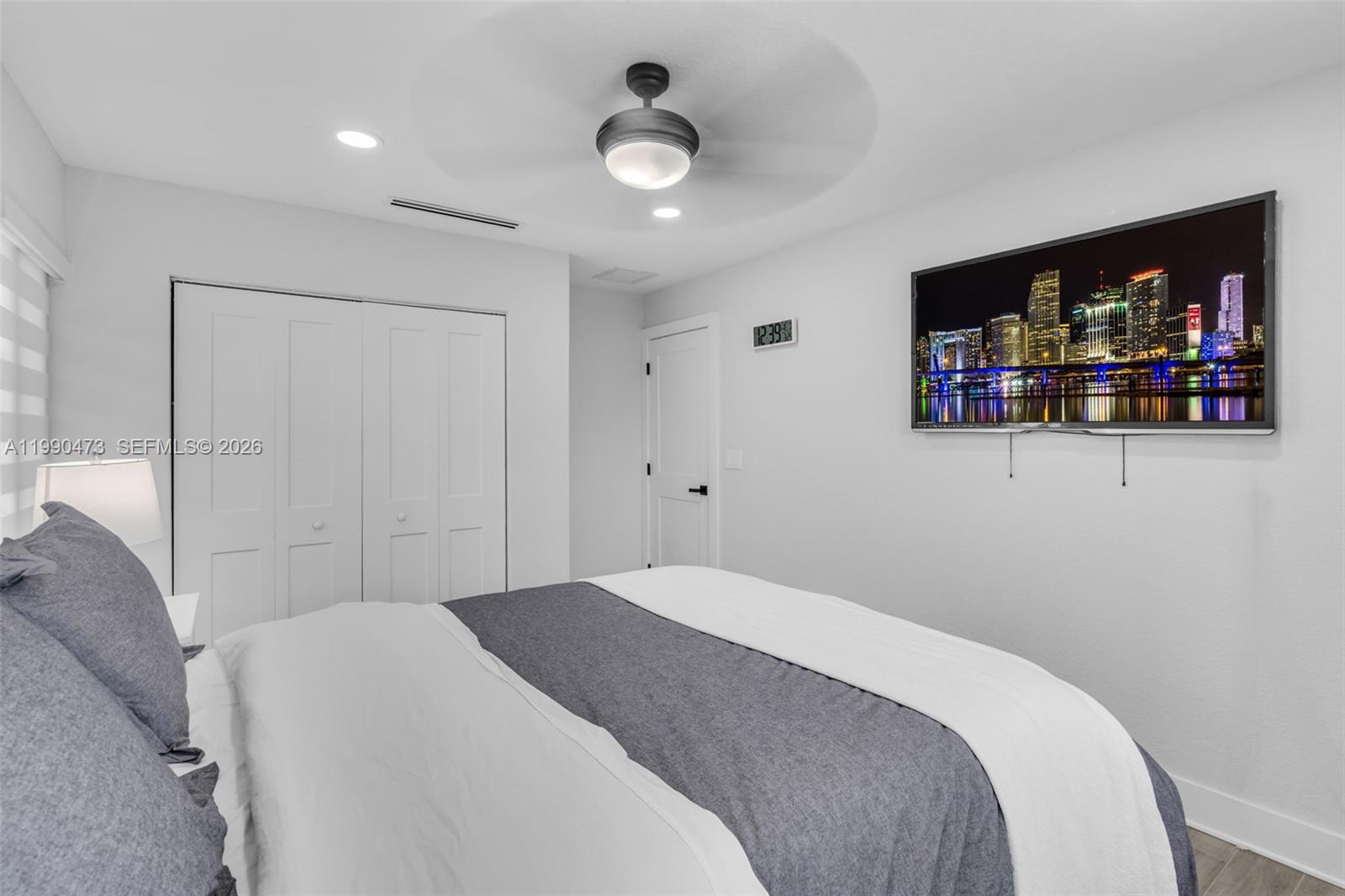 2920 Old Orchard Road Davie, FL 33328 - Photo 23 of 62 a bedroom with a large bed and a flat screen tv