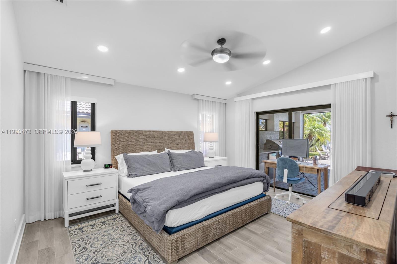2920 Old Orchard Road Davie, FL 33328 - Photo 24 of 62 a bedroom with a bed and wooden floor