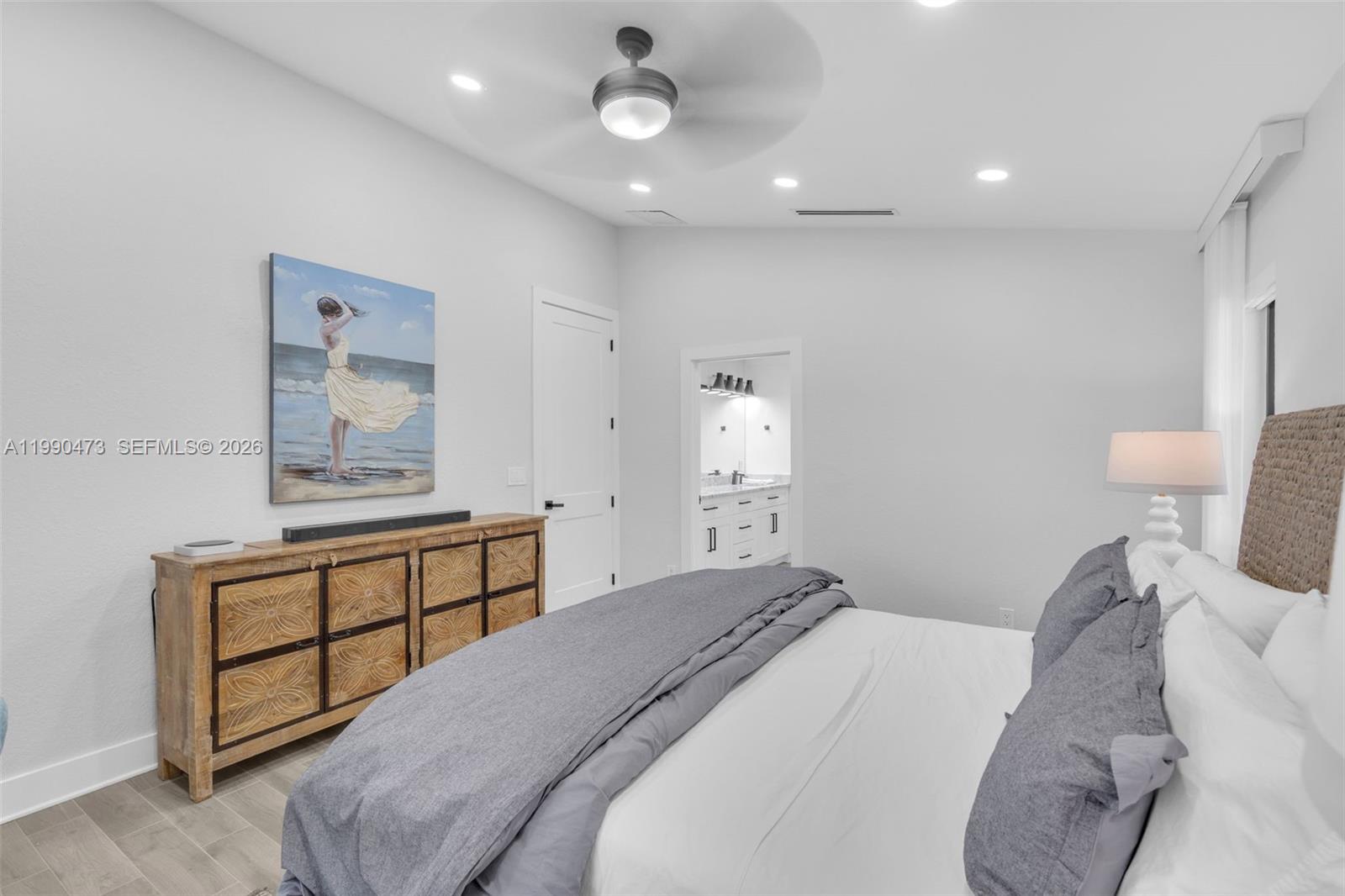 2920 Old Orchard Road Davie, FL 33328 - Photo 26 of 62 a bedroom with a bed and a dresser with mirror