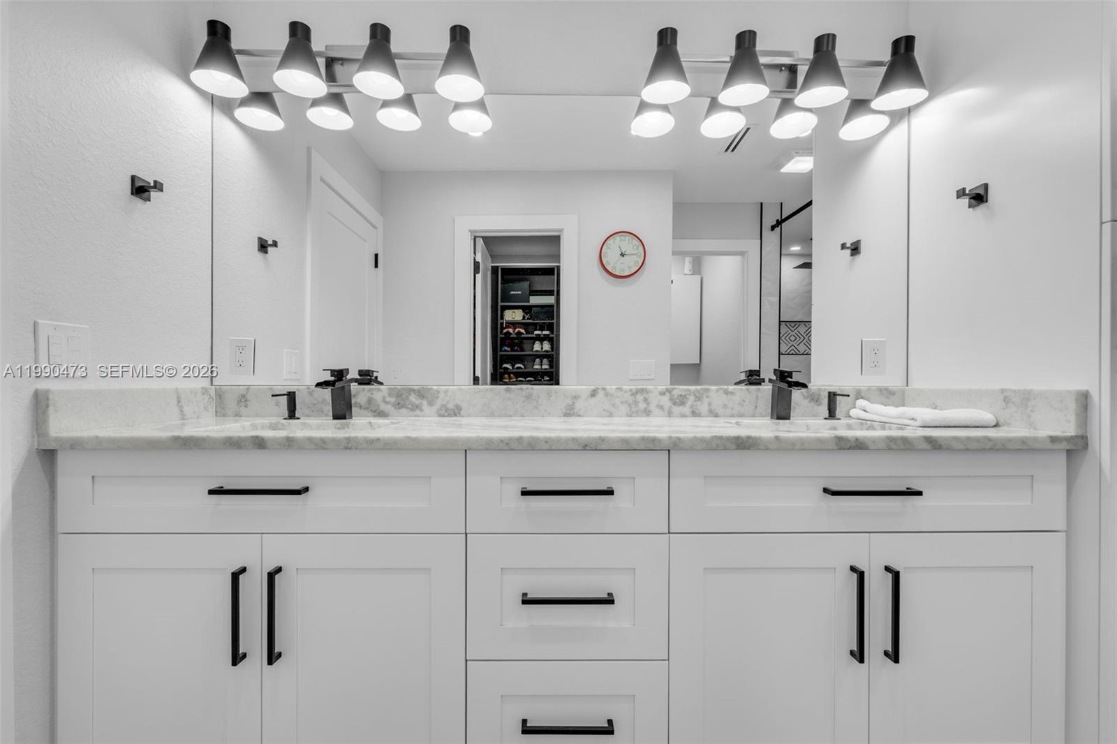 2920 Old Orchard Road Davie, FL 33328 - Photo 28 of 62 a bathroom with a sink vanity and a mirror