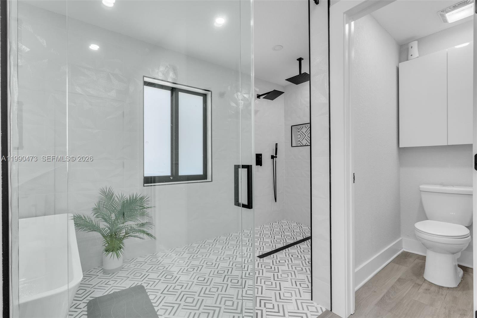 2920 Old Orchard Road Davie, FL 33328 - Photo 29 of 62 a bathroom with a granite countertop shower a sink and a toilet