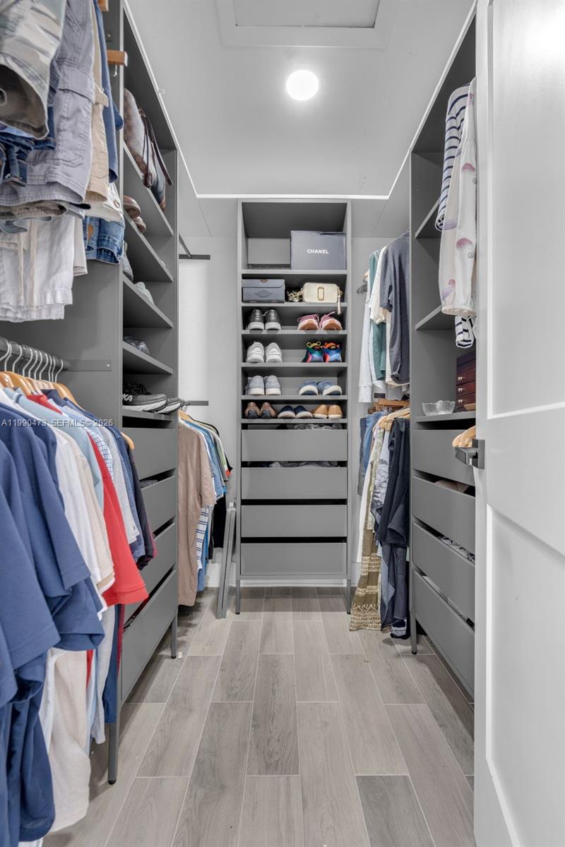 2920 Old Orchard Road Davie, FL 33328 - Photo 32 of 62 a view of walk in closet with clothes and shoes