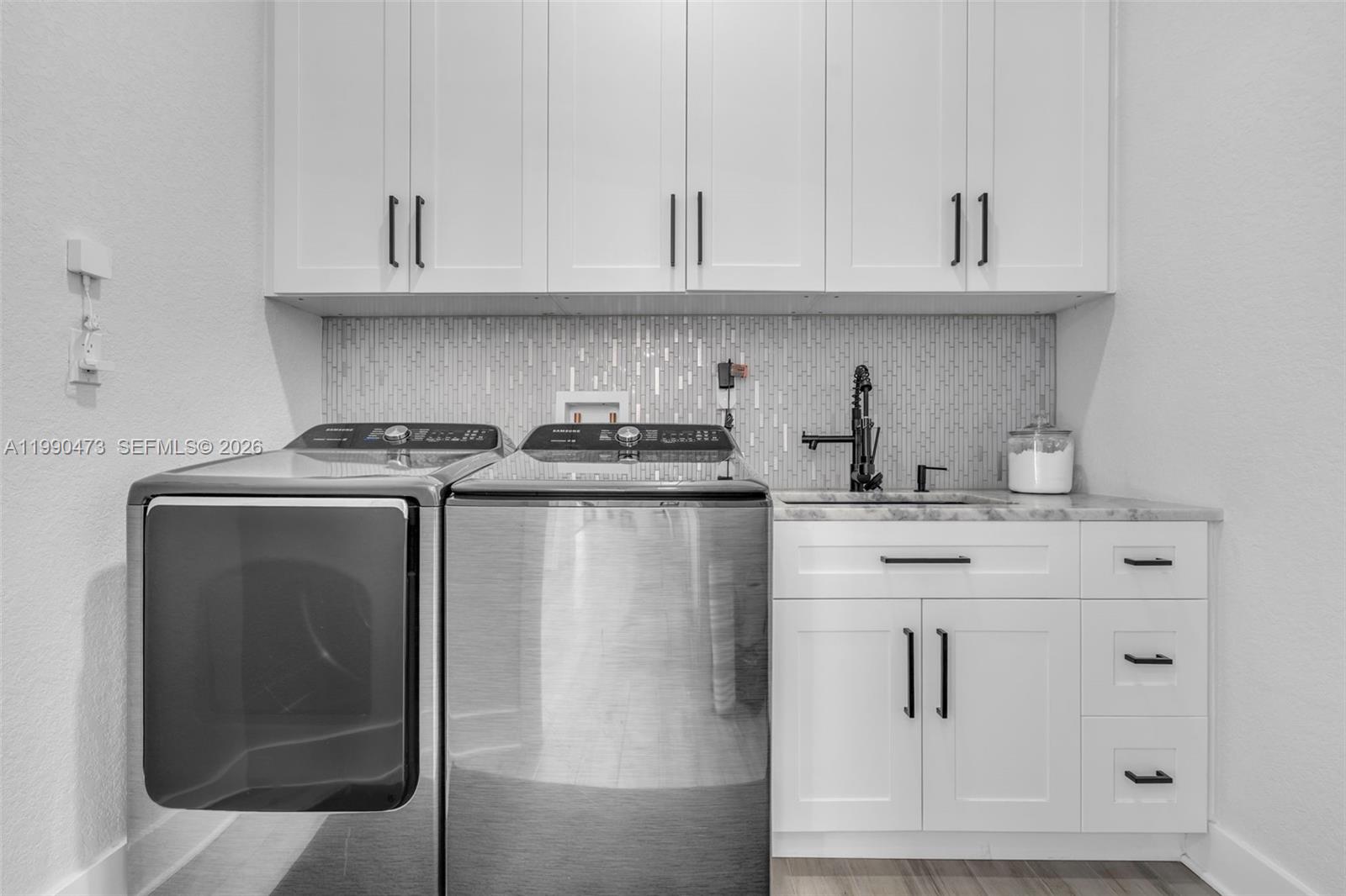 2920 Old Orchard Road Davie, FL 33328 - Photo 33 of 62 a kitchen with stainless steel appliances granite countertop a sink and a microwave