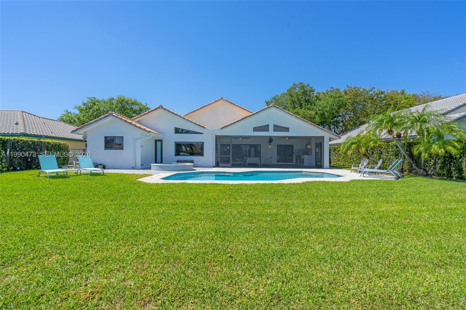 2920 Old Orchard Road Davie, FL 33328 - Photo 41 of 62 a front view of house with yard and swimming pool