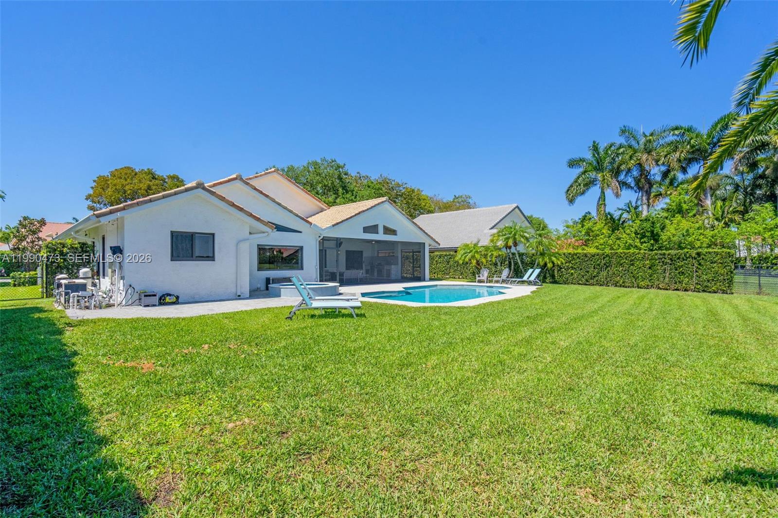 2920 Old Orchard Road Davie, FL 33328 - Photo 42 of 62 a front view of a house with garden