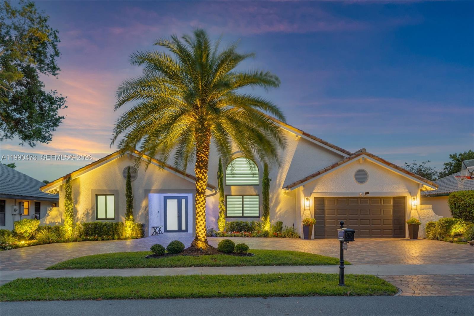 2920 Old Orchard Road Davie, FL 33328 - Photo 48 of 62 a front view of house with yard and green space