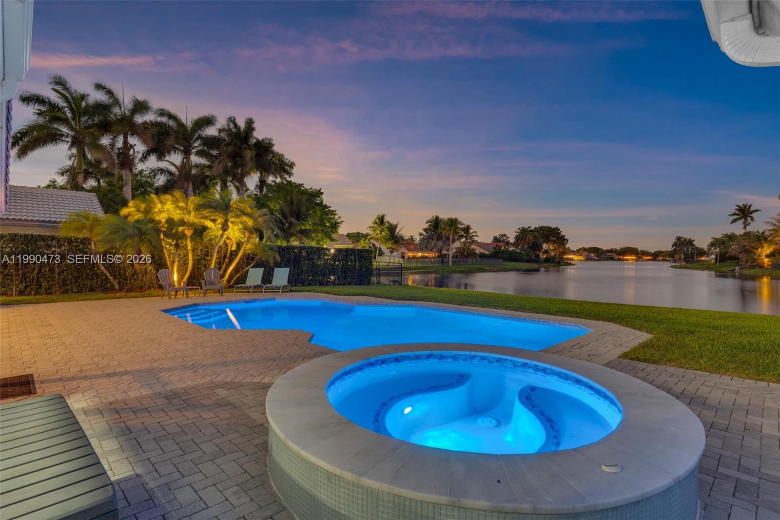 2920 Old Orchard Road Davie, FL 33328 - Photo 52 of 62 a view of swimming pool with a yard and seating