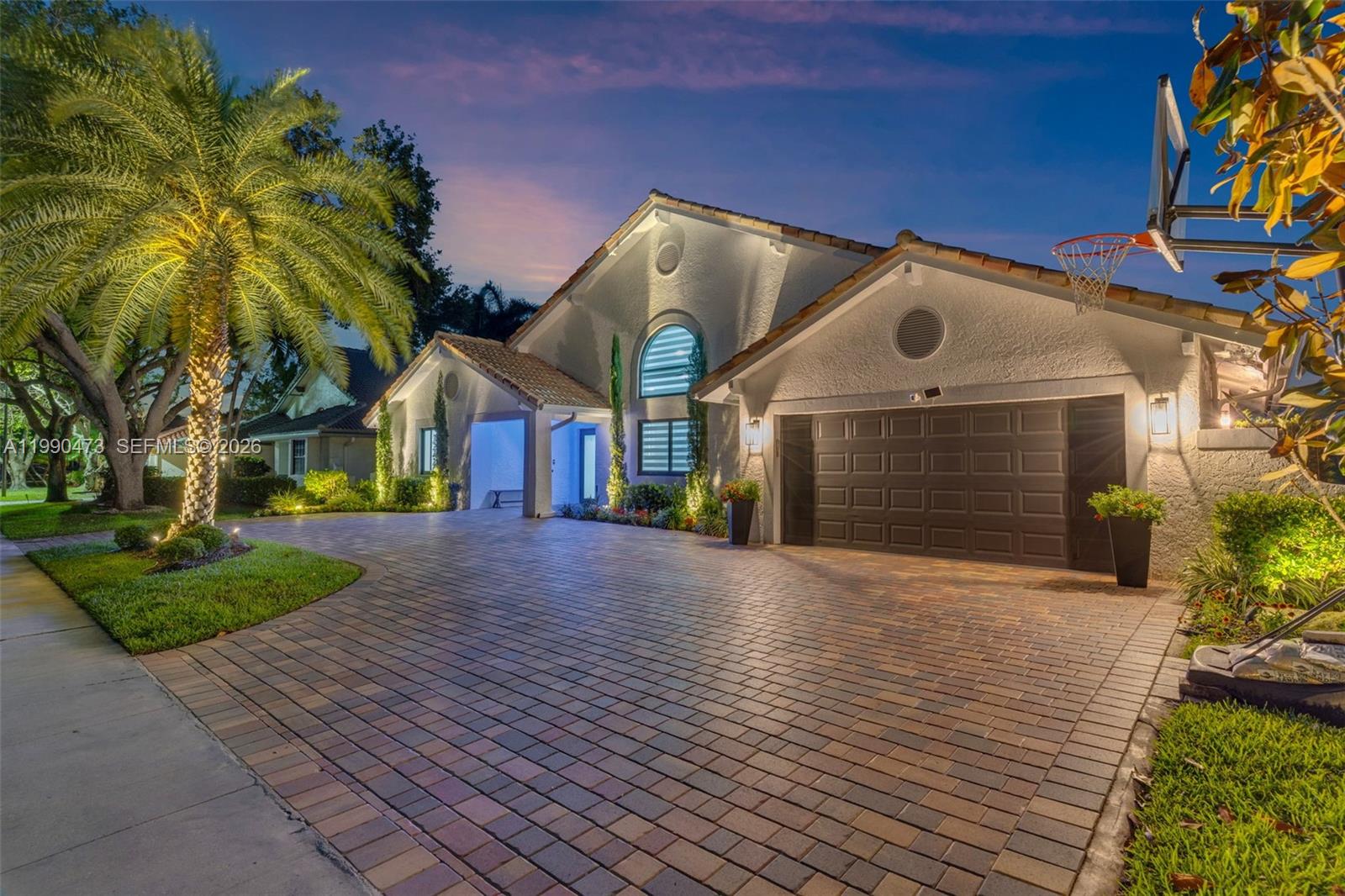 2920 Old Orchard Road Davie, FL 33328 - Photo 55 of 62 a front view of a house with a yard and garage