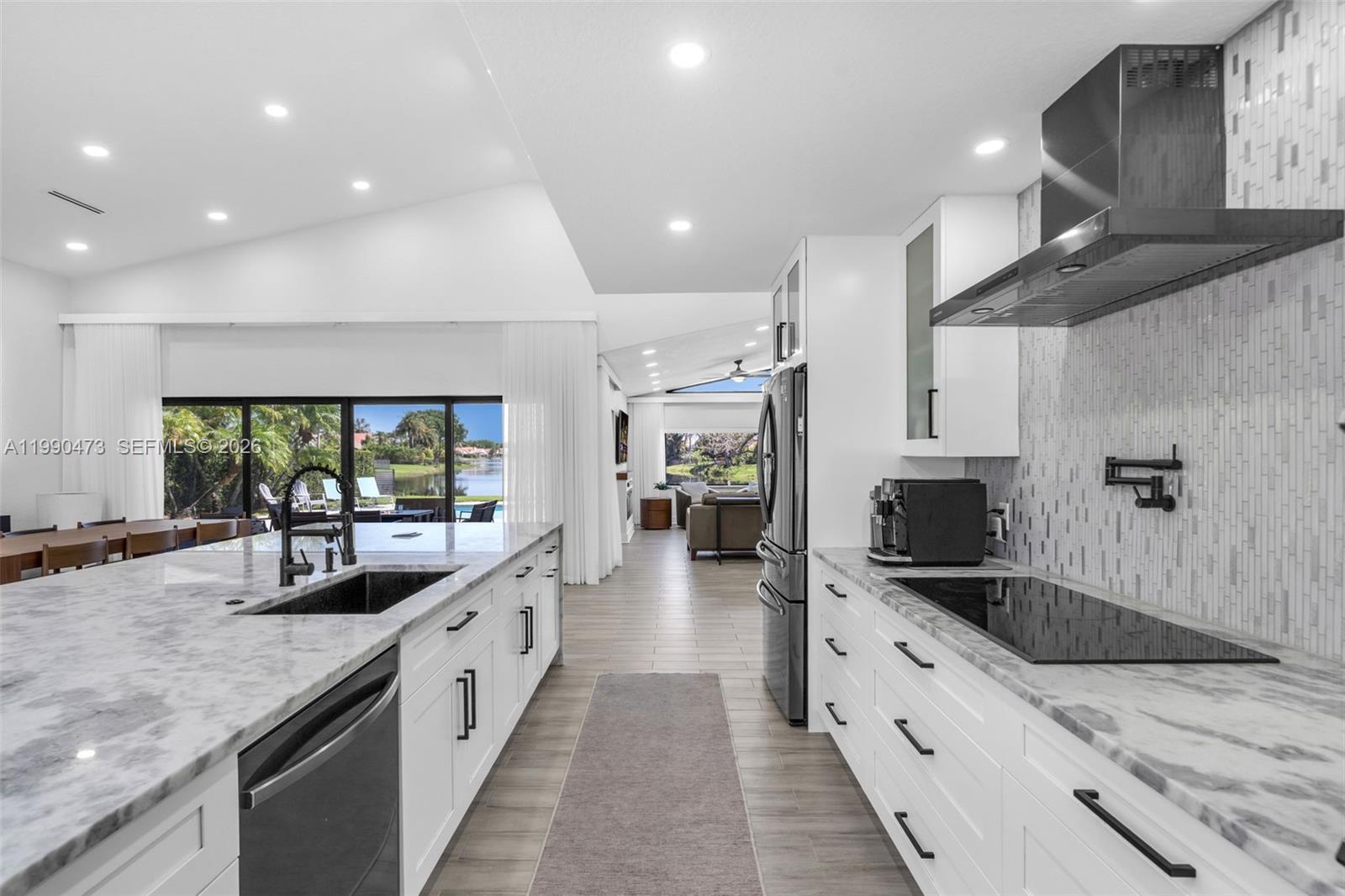 2920 Old Orchard Road Davie, FL 33328 - Photo 8 of 62 a large kitchen with stainless steel appliances granite countertop a lot of counter space and a sink