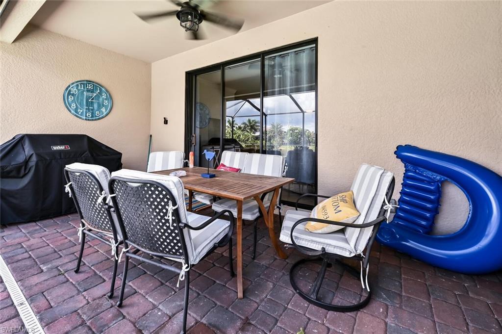 3742 Treasure Cove Circle Naples, FL 34114 - Photo 20 of 22 a view of a dining room with furniture a rug and wooden floor