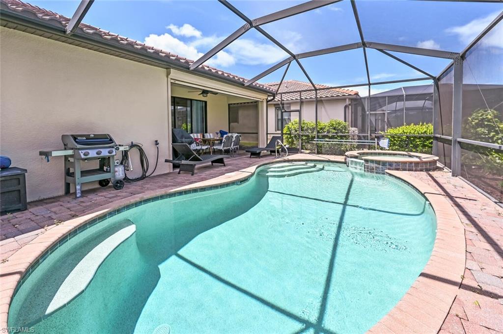 3742 Treasure Cove Circle Naples, FL 34114 - Photo 21 of 22 a view of a swimming pool with a patio