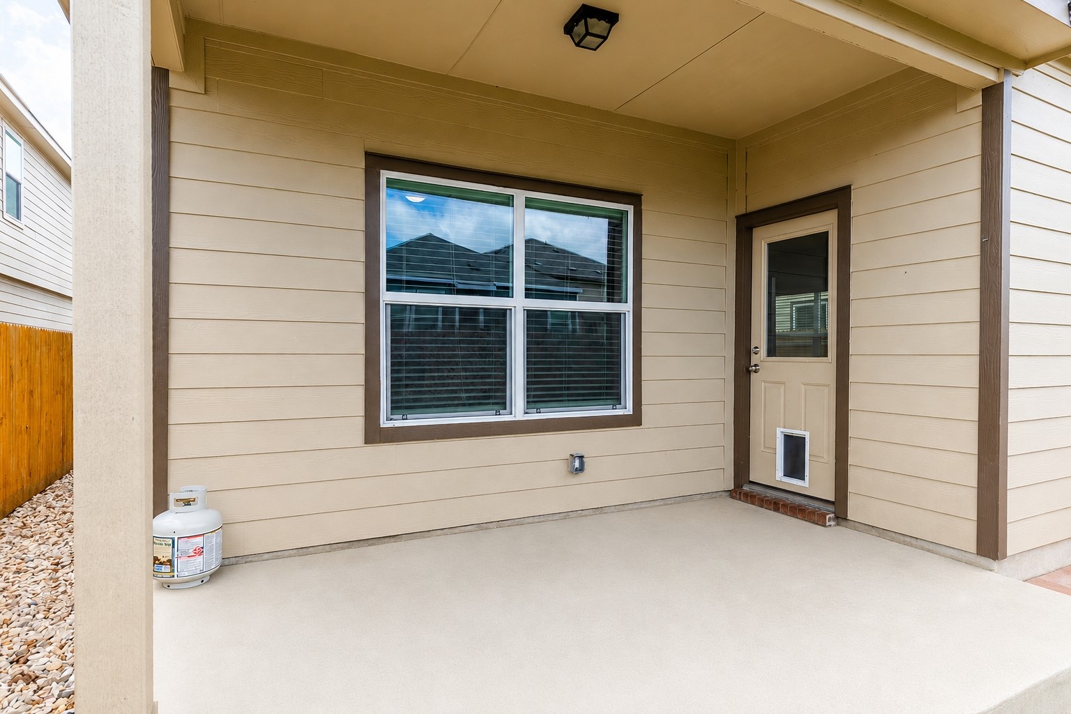 425 Perfect World Loop Jarrell, TX 76537 - Photo 24 of 28 A well-maintained covered patio provides a delightful outdoor living space.