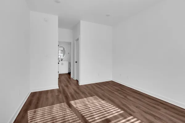 a view of gallery with wooden floor