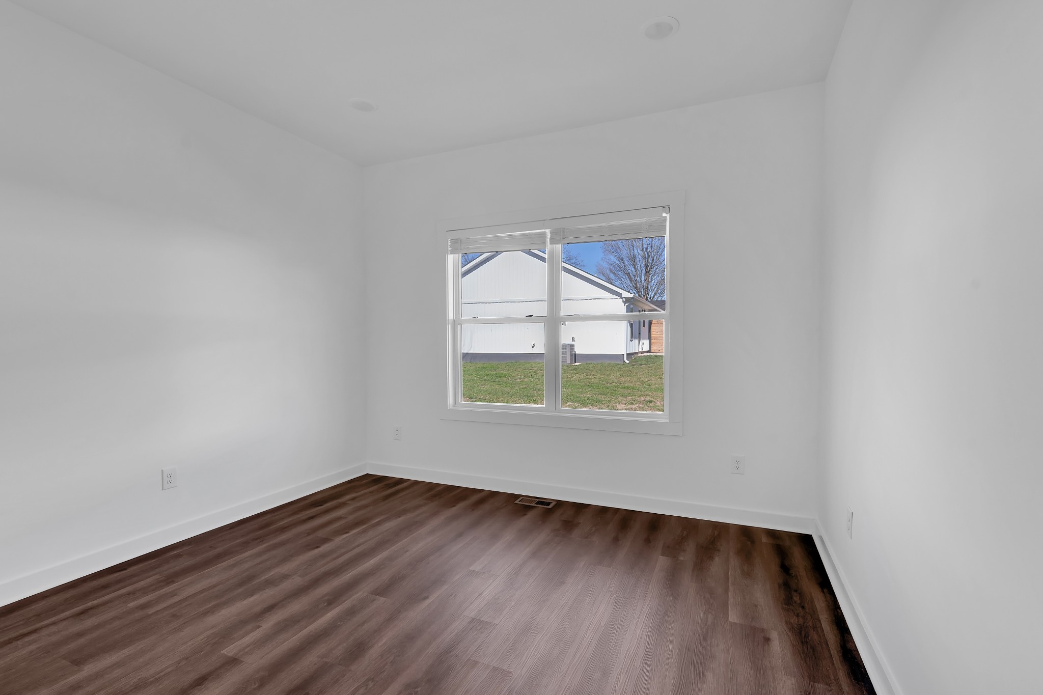 65 Duncan Lane Winchester, TN 37398 - Photo 32 of 55 an empty room with wooden floor and windows